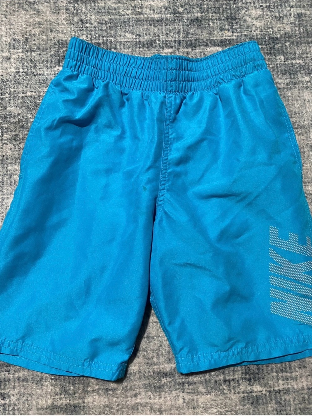 Nike Kids blue swim trunks size small